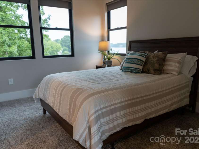 113 Angler Place, Mooresville, NC 28117.  MLS# CAR4217106, YatesRealty ID 2772. Third bedroom with the lake views.