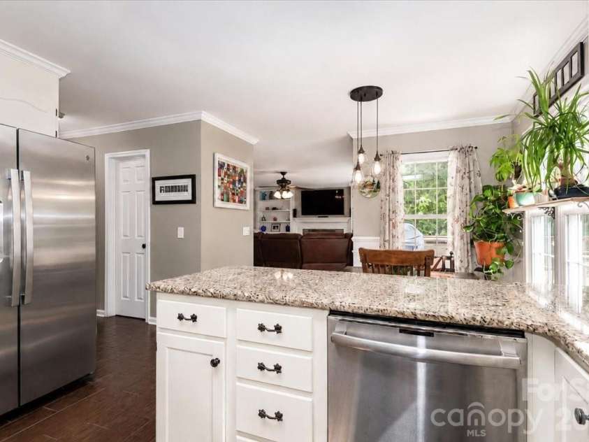 311 Deerfield Circle, Salisbury, NC 28147.  MLS# CAR4385691, YatesRealty ID 27728. Kitchen looking into Family Room