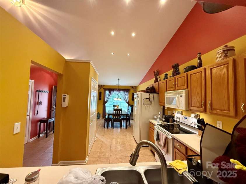 7267 Sandown Court, Harrisburg, NC 28075.  MLS# CAR4268335, YatesRealty ID 27737. Kitchen view from the living room