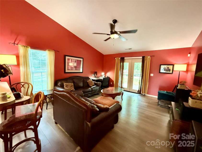7267 Sandown Court, Harrisburg, NC 28075.  MLS# CAR4268335, YatesRealty ID 27737. Living room with brand new double doors going out to the back yard