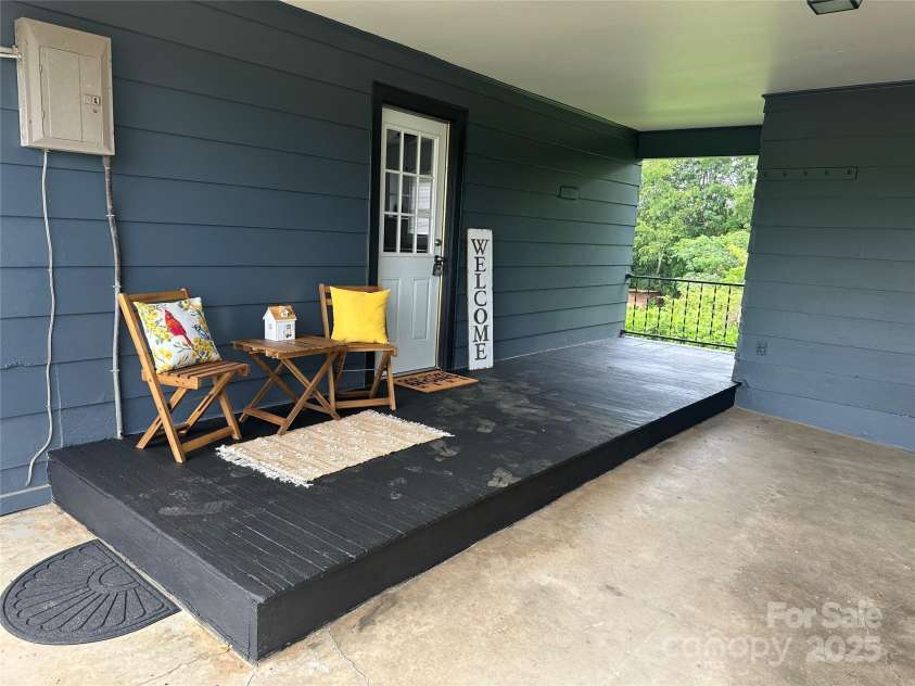 60 White Oaks Drive, Taylorsville, NC 28681.  MLS# CAR4273821, YatesRealty ID 27738. Sitting area adjoining carport