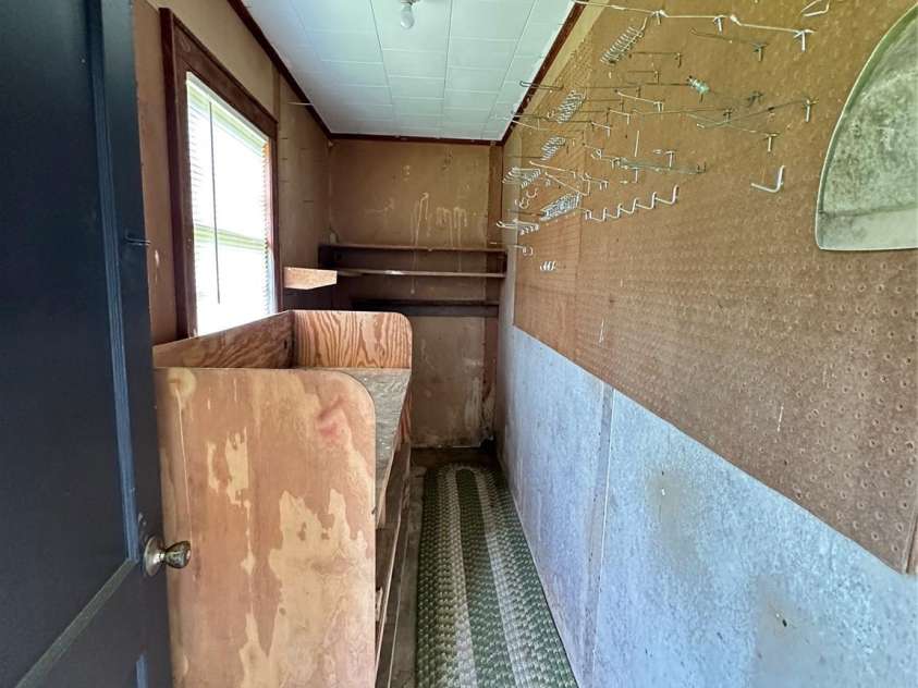 60 White Oaks Drive, Taylorsville, NC 28681.  MLS# CAR4273821, YatesRealty ID 27738. Storage Room at the front of the carport