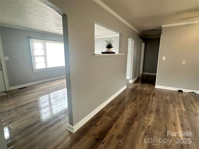 60 White Oaks Drive, Taylorsville, NC 28681.  MLS# CAR4273821, YatesRealty ID 27738. View from carport entry into kitchen, living room and down hallway