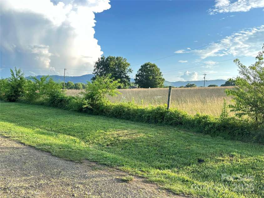 60 White Oaks Drive, Taylorsville, NC 28681.  MLS# CAR4273821, YatesRealty ID 27738. Views of Barretts Mtn from front yard