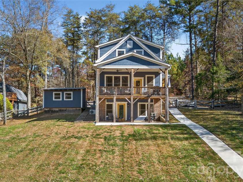 6923 Wateredge Drive, Sherrills Ford, NC 28673.  MLS# CAR4316693, YatesRealty ID 2774. Back of house looking up from the lake- Fully fenced in yard