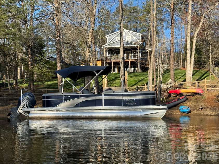 6923 Wateredge Drive, Sherrills Ford, NC 28673.  MLS# CAR4316693, YatesRealty ID 2774. From the water looking up to the house
