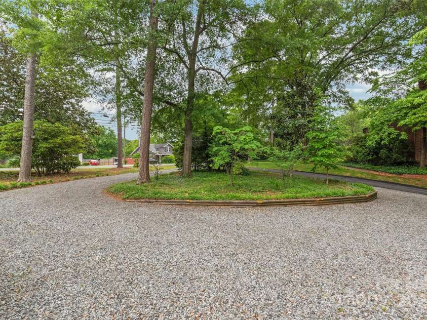 600 Central Avenue, Belmont, NC 28012.  MLS# CAR4235285, YatesRealty ID 27741. Gravel overflow drive - Great for extra parking and events!