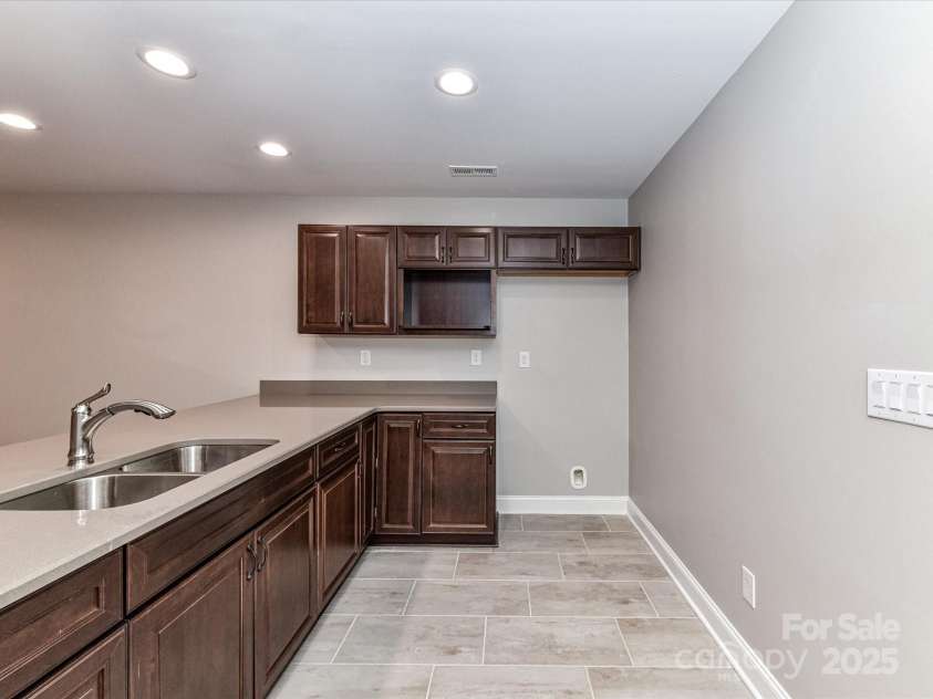 1805 Axholme Court, Waxhaw, NC 28173.  MLS# CAR4298904, YatesRealty ID 27747. Basement mini-kitchen