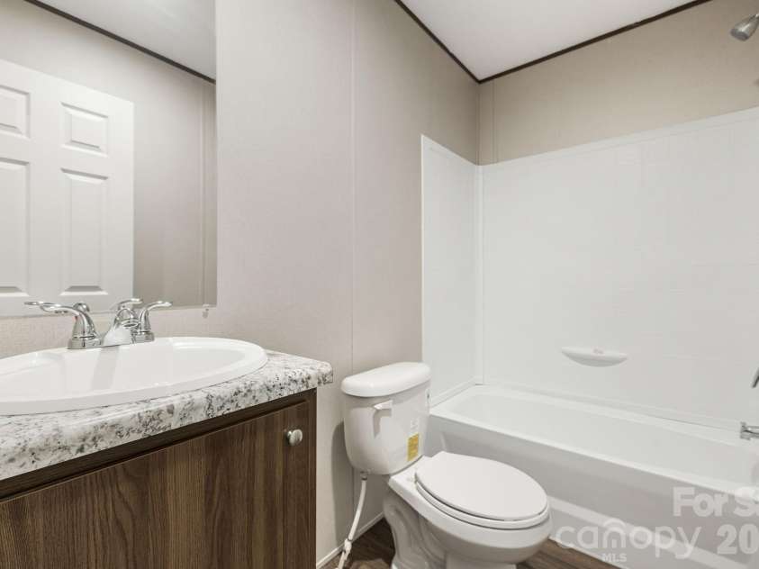67 Vista Drive, Nebo, NC 28761.  MLS# CAR4389784, YatesRealty ID 27759. Guest bathroom