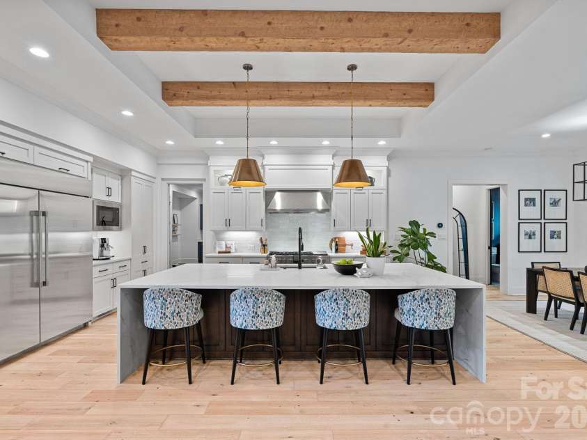 17416 Gillican Overlook Road, Davidson, NC 28036.  MLS# CAR4373444, YatesRealty ID 27790. Massive kitchen island with statement piece waterfall quartz countertop