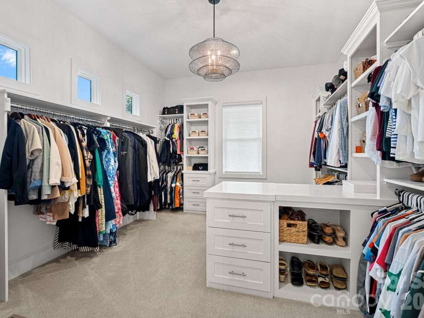 17416 Gillican Overlook Road, Davidson, NC 28036.  MLS# CAR4373444, YatesRealty ID 27790. Primary closet with custom cabinetry