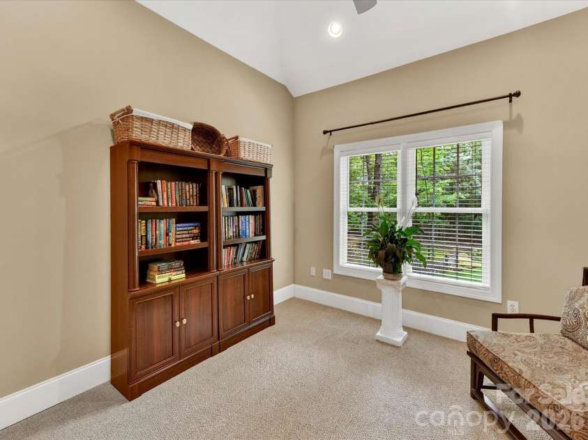 11615 Hidden Forest Lane, Davidson, NC 28036.  MLS# CAR4386264, YatesRealty ID 27816. Versatile flex space off the primary suite offers the perfect setting for a sitting room, home office, nursery, or private retreat.