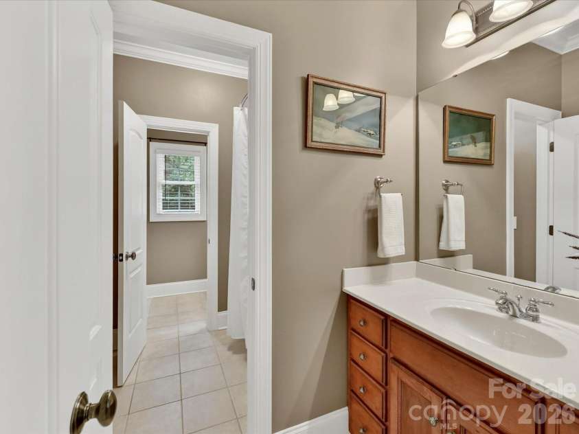 11615 Hidden Forest Lane, Davidson, NC 28036.  MLS# CAR4386264, YatesRealty ID 27816. Well-appointed Jack-and-Jill bath features a spacious vanity with ample storage and convenient access for adjoining bedrooms.
