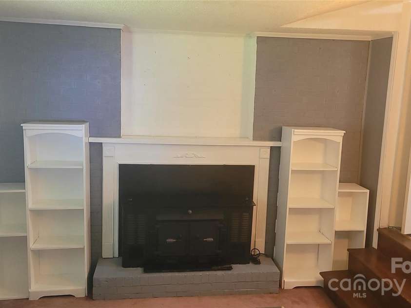 1632 Kimberly Drive, Gastonia, NC 28052.  MLS# CAR4274703, YatesRealty ID 27821. Den with wood burning insert