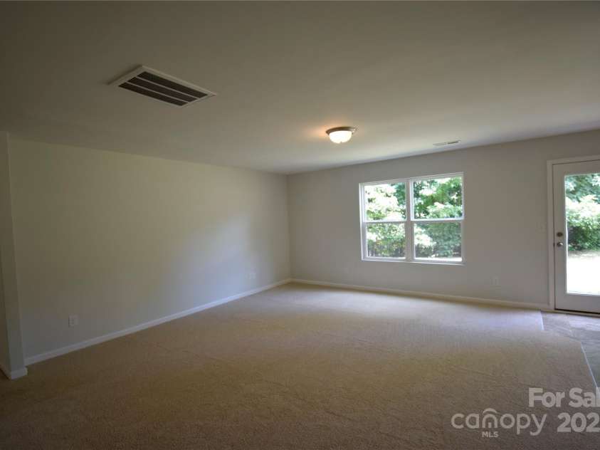 9721 Castle Terrace Court, Charlotte, NC 28215.  MLS# CAR4285111, YatesRealty ID 27823. Family room