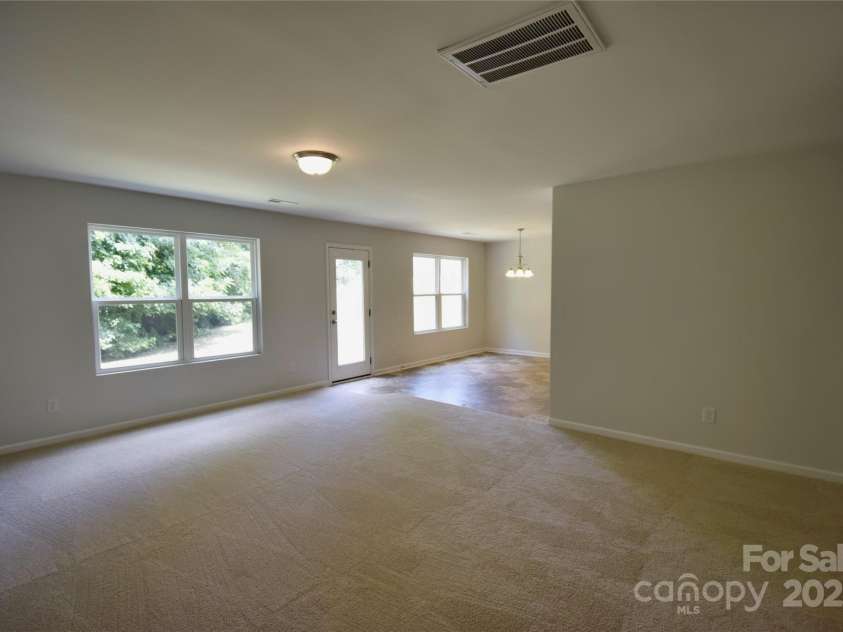 9721 Castle Terrace Court, Charlotte, NC 28215.  MLS# CAR4285111, YatesRealty ID 27823. Family room