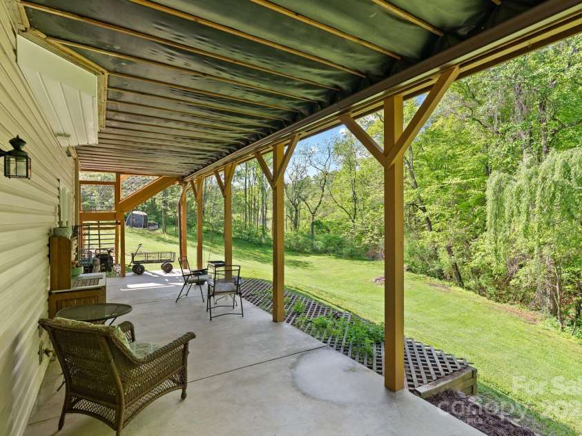 50 Pinerose Drive, Weaverville, NC 28787.  MLS# CAR4255853, YatesRealty ID 27829. Daylight Basement Patio