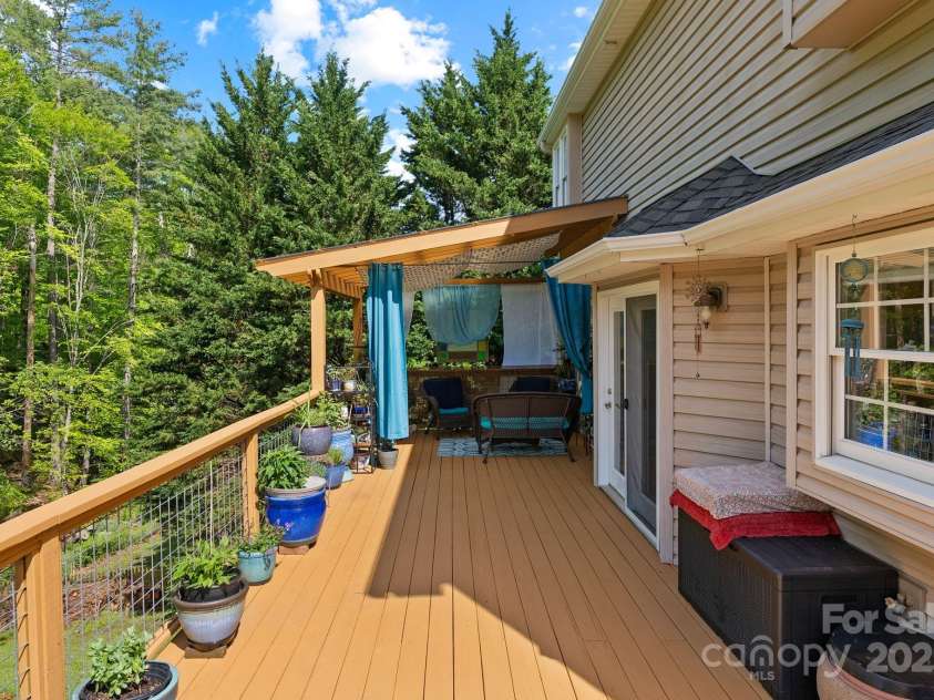 50 Pinerose Drive, Weaverville, NC 28787.  MLS# CAR4255853, YatesRealty ID 27829. Elevated Back Deck w/Covered Sitting Area
