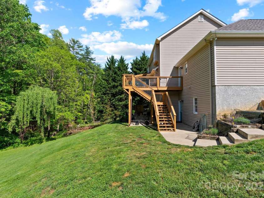 50 Pinerose Drive, Weaverville, NC 28787.  MLS# CAR4255853, YatesRealty ID 27829. Expansive Backyard