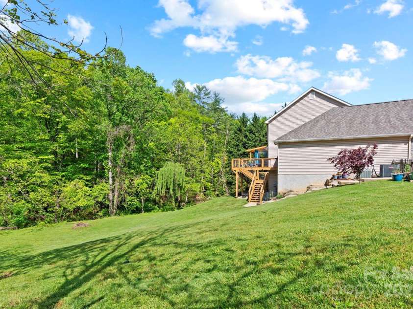 50 Pinerose Drive, Weaverville, NC 28787.  MLS# CAR4255853, YatesRealty ID 27829. Expansive Backyard w/Stream