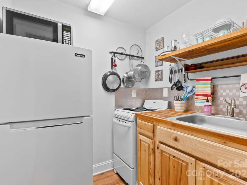 50 Pinerose Drive, Weaverville, NC 28787.  MLS# CAR4255853, YatesRealty ID 27829. Kitchenette in Daylight Basement