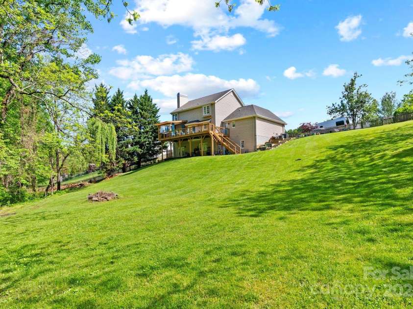 50 Pinerose Drive, Weaverville, NC 28787.  MLS# CAR4255853, YatesRealty ID 27829. Large, Rolling Backyard