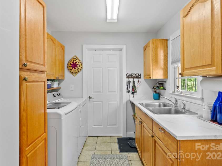 50 Pinerose Drive, Weaverville, NC 28787.  MLS# CAR4255853, YatesRealty ID 27829. Main Level Laundry Room