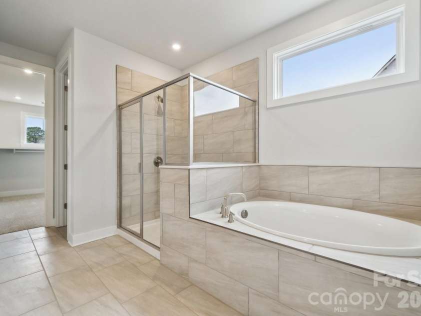 3711 Roughedge Drive, Monroe, NC 28112.  MLS# CAR4342569, YatesRealty ID 27845. Rep primary bath