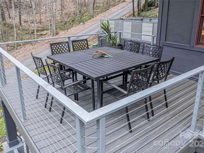 1585 Eagles Nest Road, Waynesville, NC 28786.  MLS# CAR4171726, YatesRealty ID 27848. Balcony with table