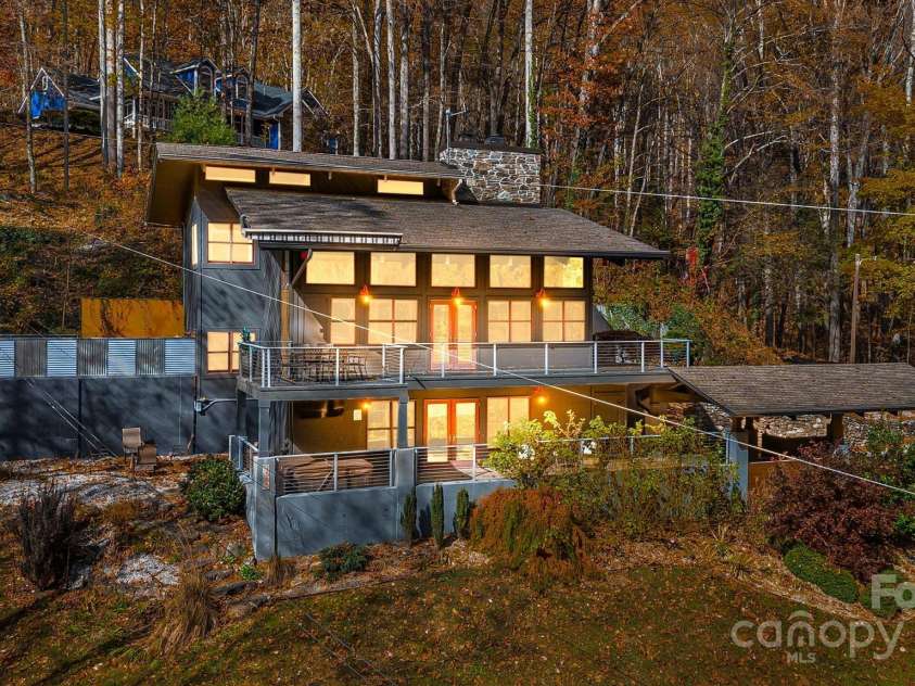 1585 Eagles Nest Road, Waynesville, NC 28786.  MLS# CAR4171726, YatesRealty ID 27848. Exterior evening