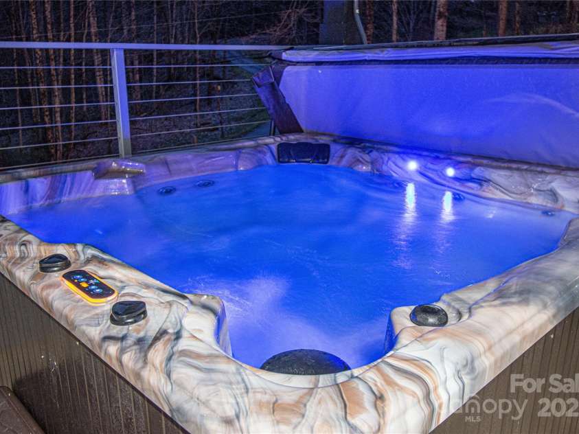 1585 Eagles Nest Road, Waynesville, NC 28786.  MLS# CAR4171726, YatesRealty ID 27848. Hot tub