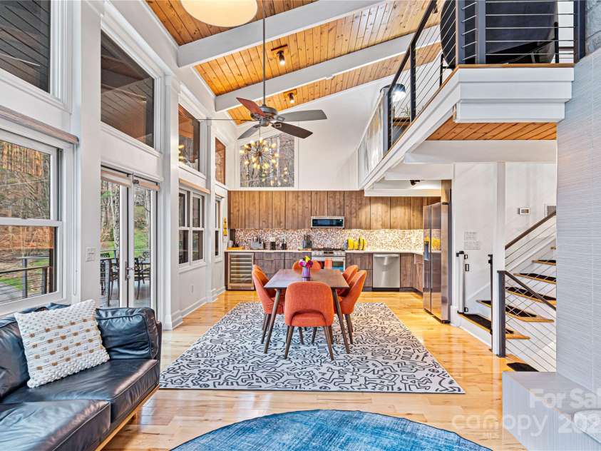 1585 Eagles Nest Road, Waynesville, NC 28786.  MLS# CAR4171726, YatesRealty ID 27848. Living room, dining room, and kitchen