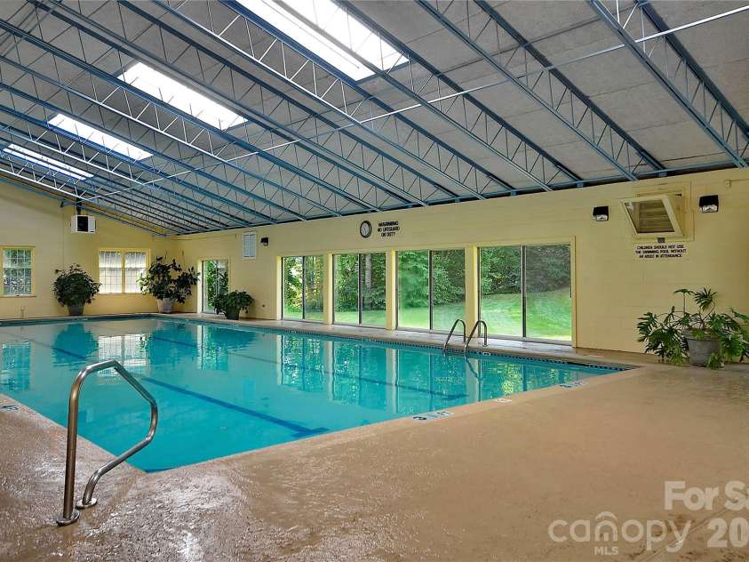 606 Carriage Commons Drive, Hendersonville, NC 28791.  MLS# CAR4386176, YatesRealty ID 27849. Indoor Pool 