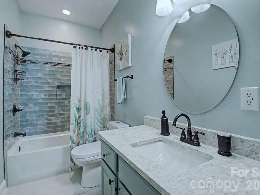 606 Carriage Commons Drive, Hendersonville, NC 28791.  MLS# CAR4386176, YatesRealty ID 27849. Masterfully Renovated Guest Bath Main 
