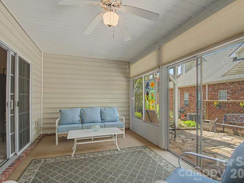 606 Carriage Commons Drive, Hendersonville, NC 28791.  MLS# CAR4386176, YatesRealty ID 27849. Sunroom Lower Level