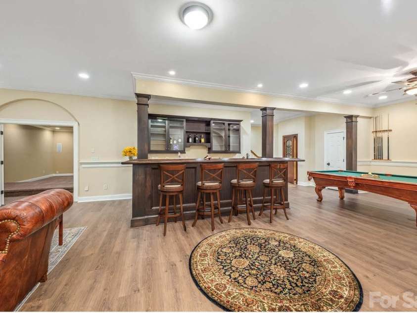 946 Laurel Creek Lane, Charlotte, NC 28211.  MLS# CAR4298519, YatesRealty ID 2785. Bar connecting living and billiards area in basement
