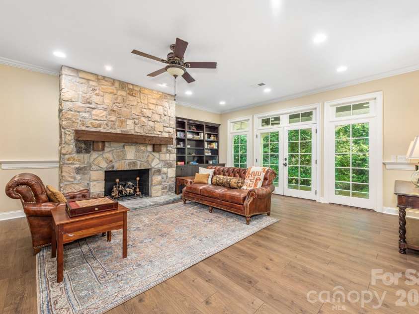 946 Laurel Creek Lane, Charlotte, NC 28211.  MLS# CAR4298519, YatesRealty ID 2785. Fireplace area in basement near the bar area and walk out covered patio