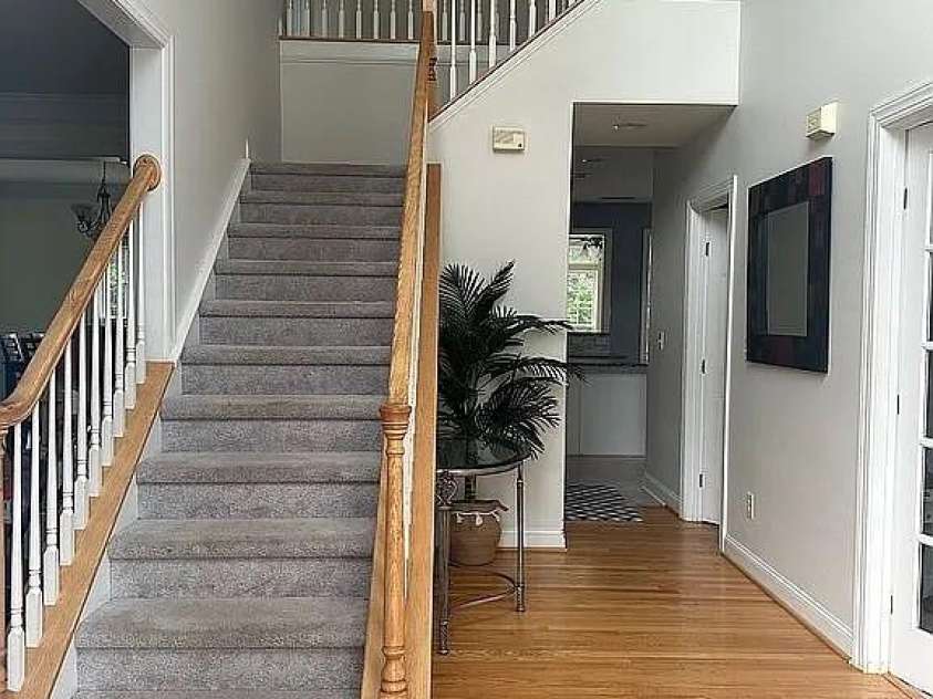 219 Flowering Grove Lane, Mooresville, NC 28115.  MLS# CAR4275731, YatesRealty ID 27853. Stunning entrance w/ hardwoods & White wooden Rails Staircasew/ carpet