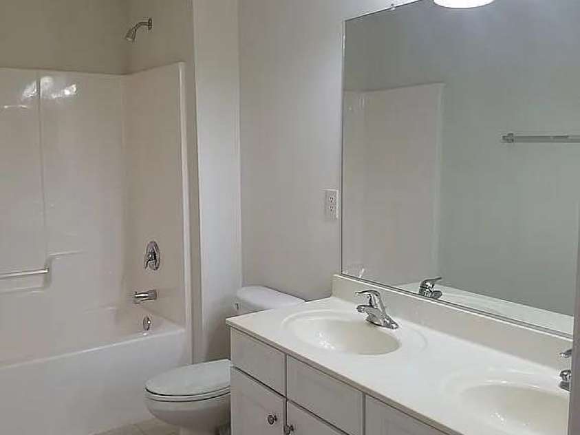 219 Flowering Grove Lane, Mooresville, NC 28115.  MLS# CAR4275731, YatesRealty ID 27853. Upstairs Guest Bathroom Dbl Vanity sinks
