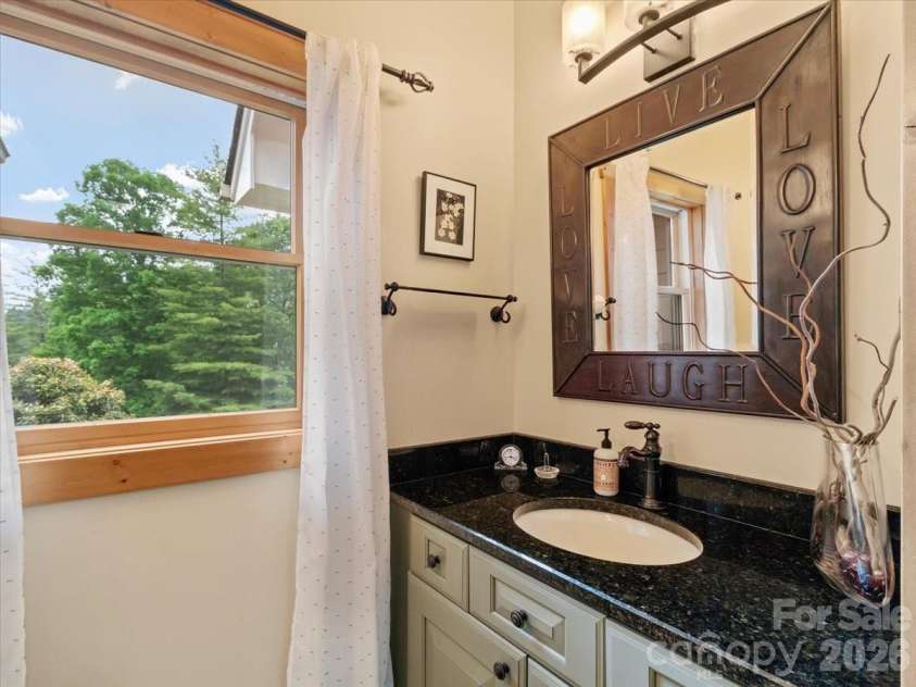 750 Barebridge Drive, Burnsville, NC 28714.  MLS# CAR4385574, YatesRealty ID 27865. Half bathroom on main level