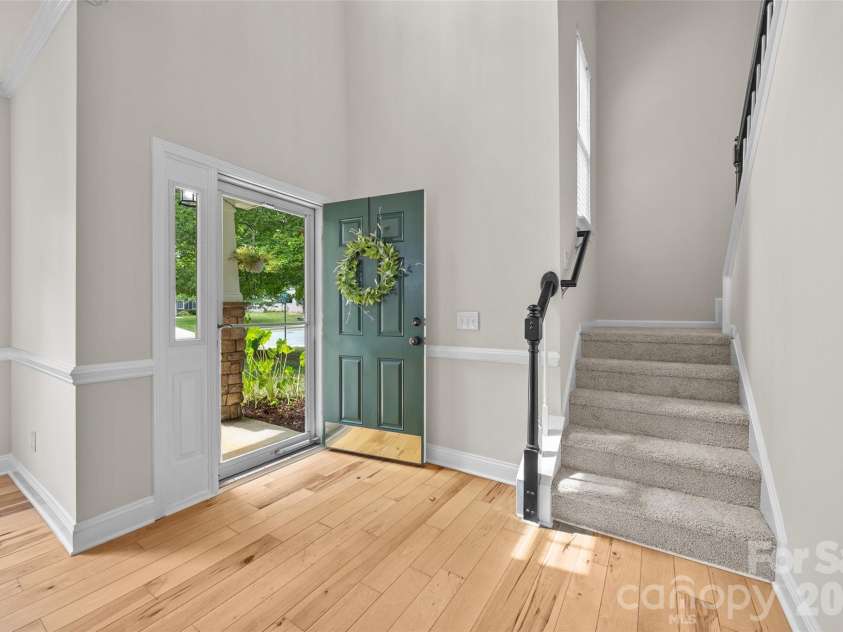 9118 Spratt Lane, Waxhaw, NC 28173.  MLS# CAR4416867, YatesRealty ID 27872. Entry- Solid Plank Hickory Floor Throughout Main Level