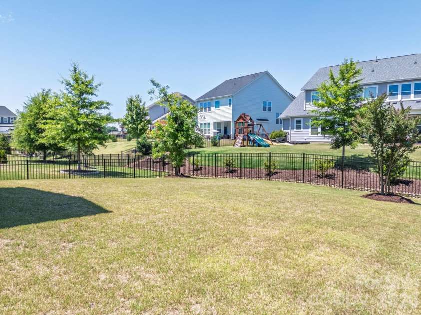 6271 Six String Court, Fort Mill, SC 29708.  MLS# CAR4384040, YatesRealty ID 27883. Level Bachyard