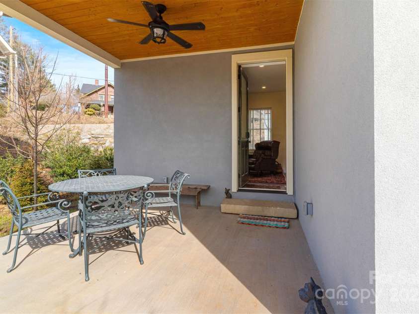 6 Houston Street, Asheville, NC 28801.  MLS# CAR4221476, YatesRealty ID 27884. Lower level covered patio and outside entrance