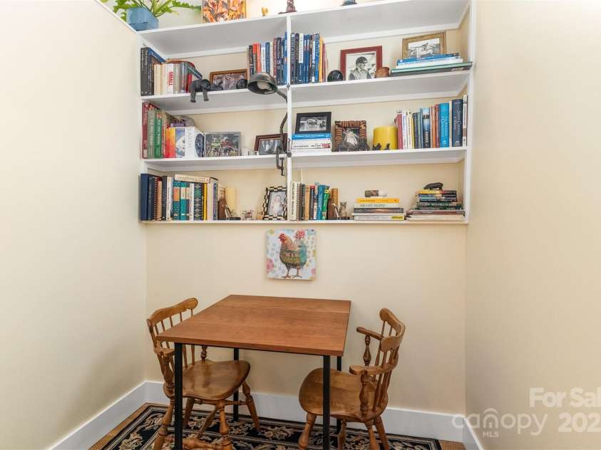 6 Houston Street, Asheville, NC 28801.  MLS# CAR4221476, YatesRealty ID 27884. Sitting nook in stairs to lower level