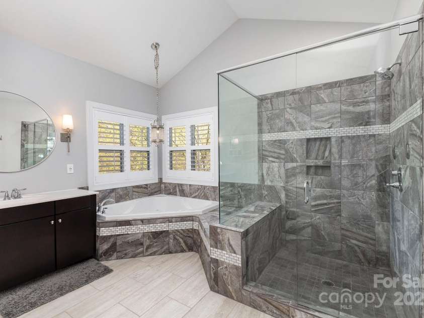 717 Barossa Valley Drive, Concord, NC 28027.  MLS# CAR4238339, YatesRealty ID 27886. Updated shower and tub in primary