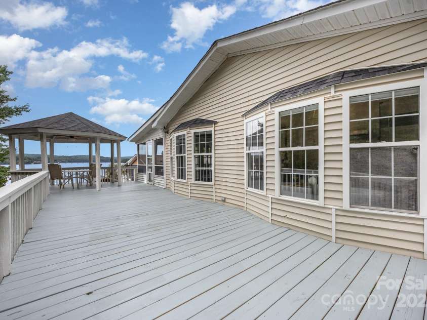 115 Trails End Lane, New London, NC 28127.  MLS# CAR4281214, YatesRealty ID 27888. Freshly stained deck