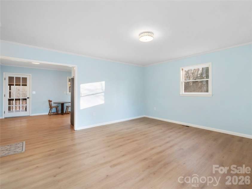 81 Fairview Heights, Waynesville, NC 28786.  MLS# CAR4334020, YatesRealty ID 2789. Living Room open to dining area