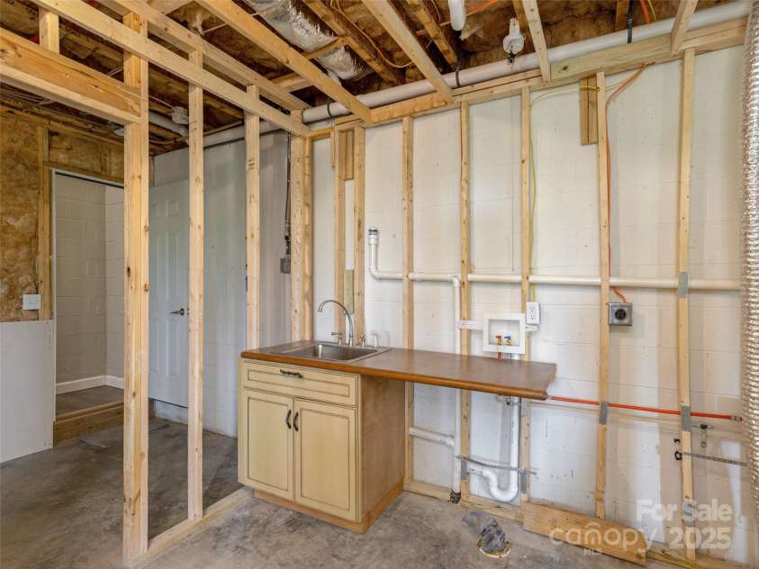 264 Splitrail Drive, Hendersonville, NC 28792.  MLS# CAR4260165, YatesRealty ID 27894. Laundry room area.