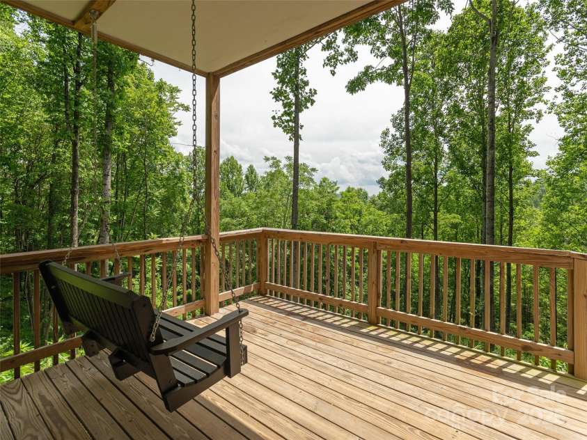 264 Splitrail Drive, Hendersonville, NC 28792.  MLS# CAR4260165, YatesRealty ID 27894. Rocking Chair covered porch on lower level.