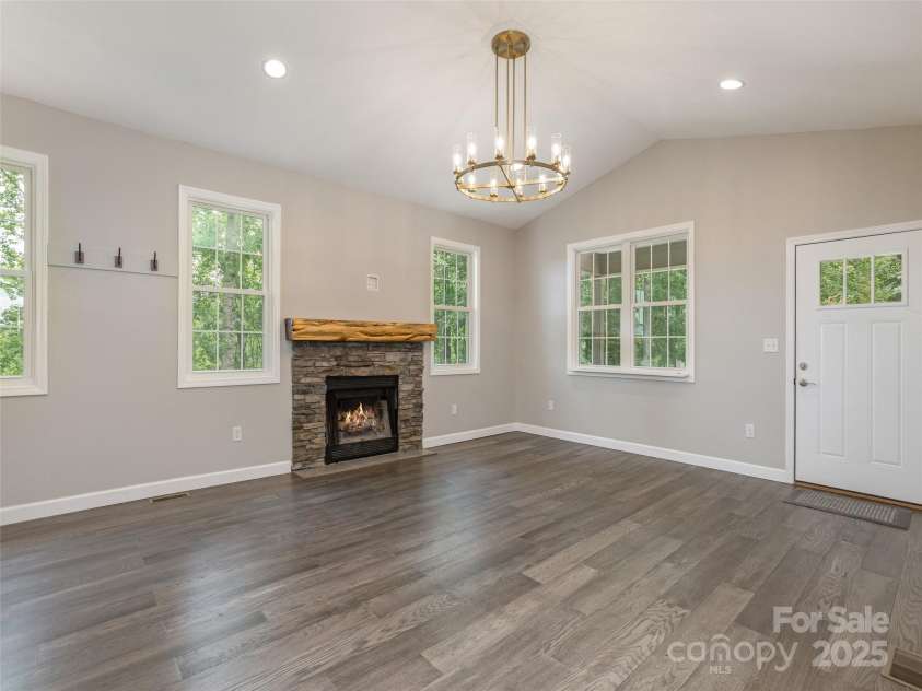 264 Splitrail Drive, Hendersonville, NC 28792.  MLS# CAR4260165, YatesRealty ID 27894. Wood burning fireplace with custom mantle.